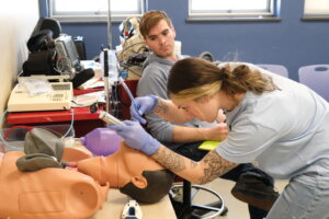 NHTI paramedic student practices intubation