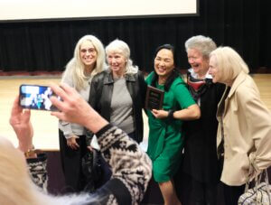 NHTI student, Janice Chase, takes a photo with supporters