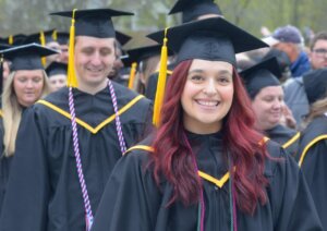 NHTI graduate smiles at commencement