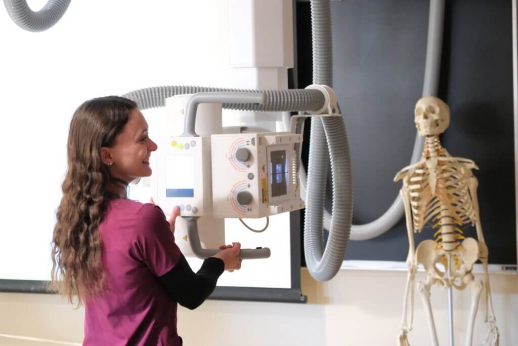 NHTI student with medical imaging equipment