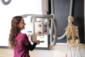 NHTI student with medical imaging equipment