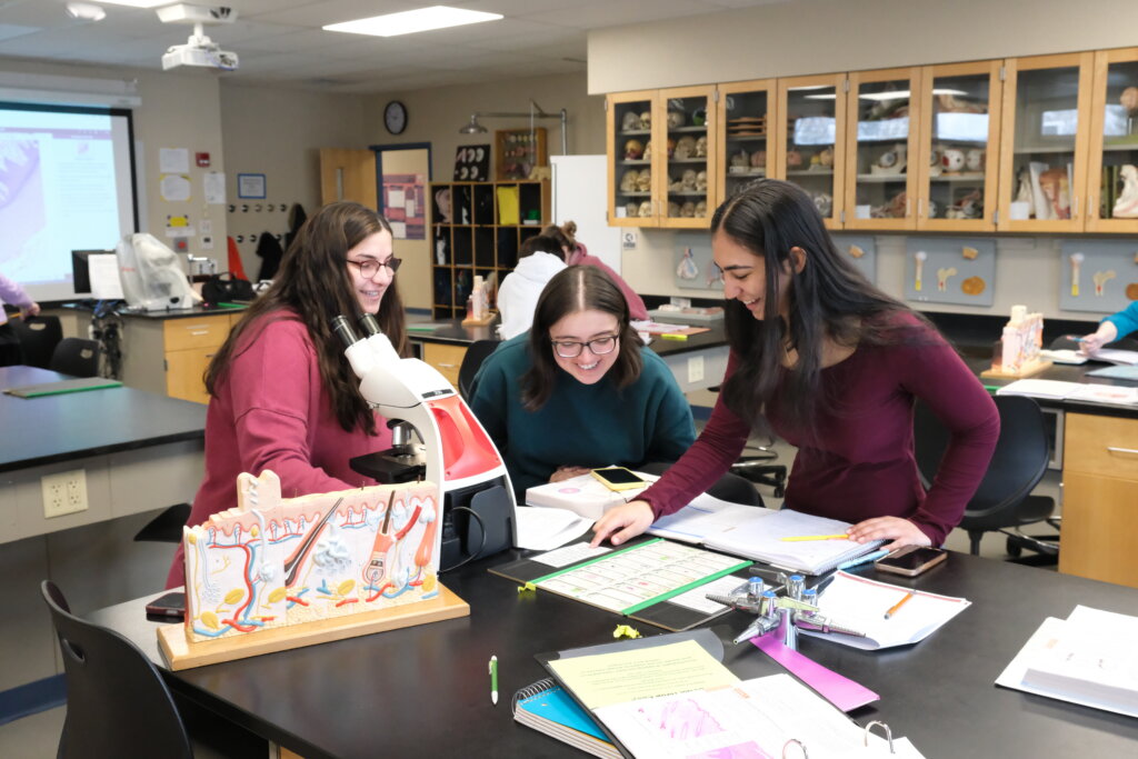 Three NHTI students in anatomy class